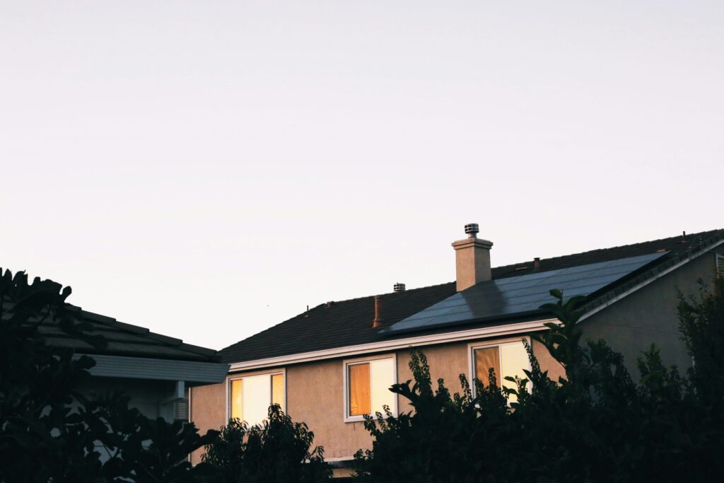 Sunrise on a house with solar panels on roof